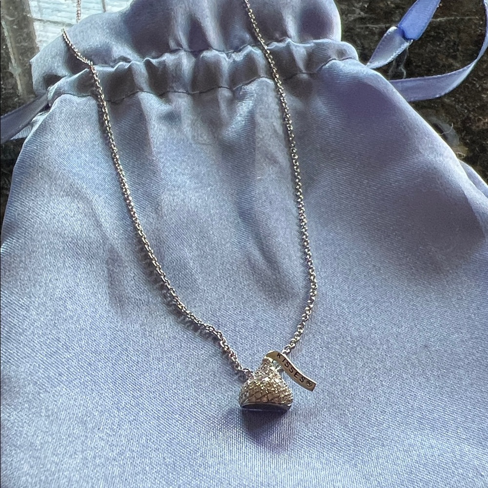 14k white gold diamond Kisses Pendant Necklace. Chain adjustable to 18”